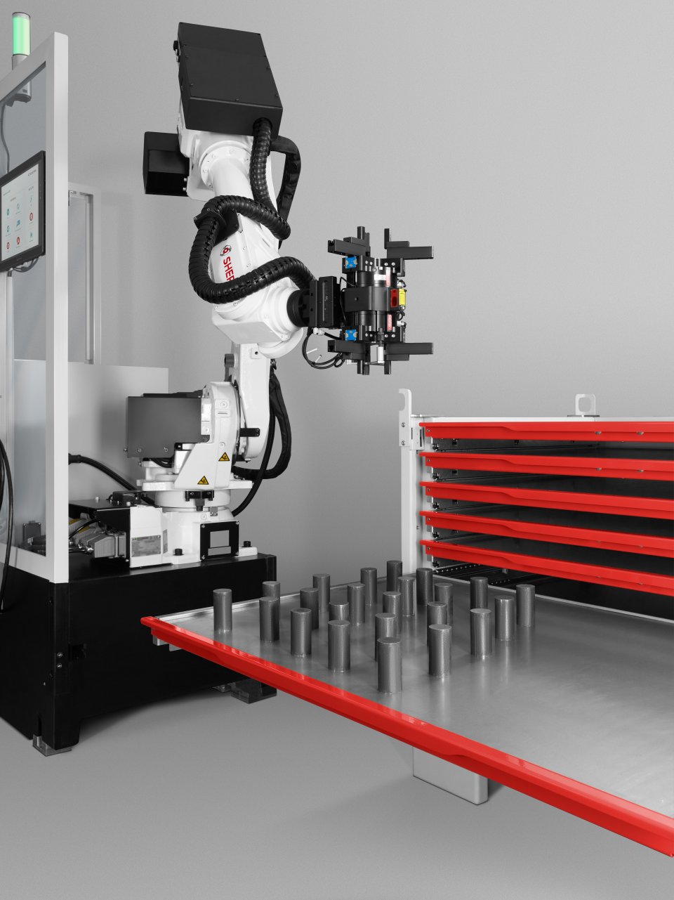 Auf dem Bild befindet sich ein weißer Roboter-Greifarm.