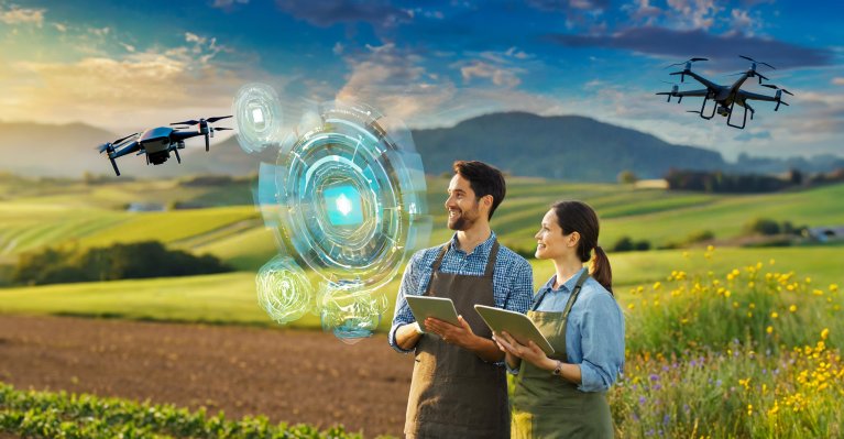 Futuristic view of two people standing in a field and virtually operating a technical system.